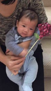 This cutie loves his Flirty Flower!